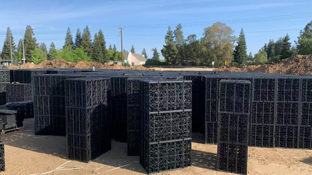 Residential stormwater crate installation showing modular units being placed in trench in Murrieta CA