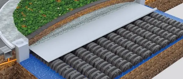 Installing open-bottom leaching chambers on crushed stone base for septic or stormwater infiltration trenches