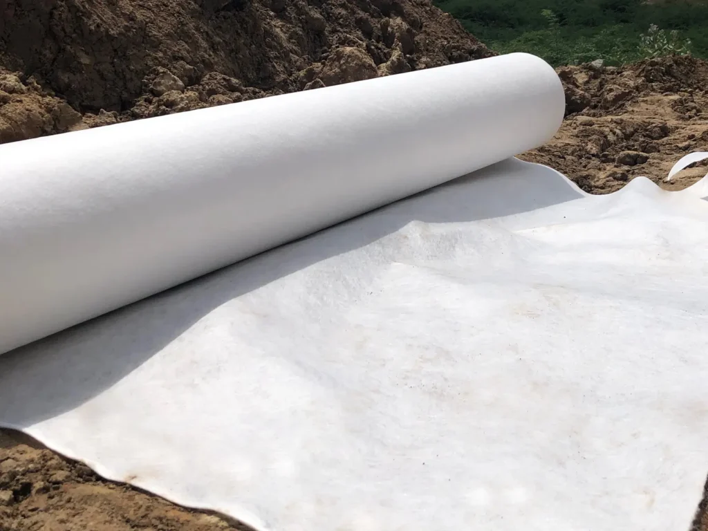 Heavy-duty geotextile under riprap for coastal erosion control and slope protection