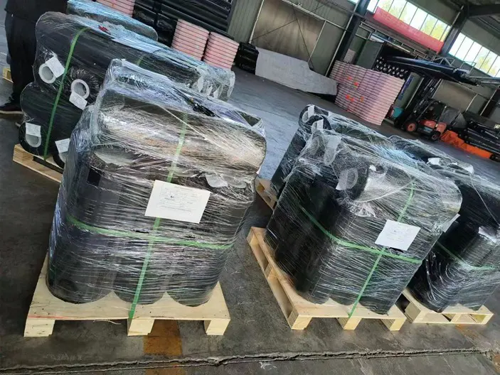 Palletized geotextile rolls with PE shrink wrap and custom labels ready for global shipping