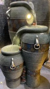 Classic tiered stone water fountain centerpiece for courtyard gardens
