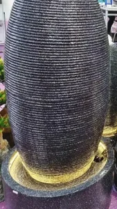 Decorative backyard water fountain creating a soothing soundscape
