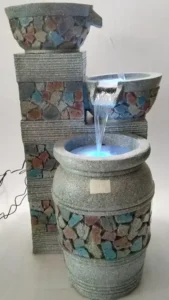 Pedestal garden fountain with cascading water effect
