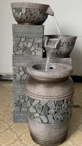 Round basin water fountain with central jet for driveway turnarounds
